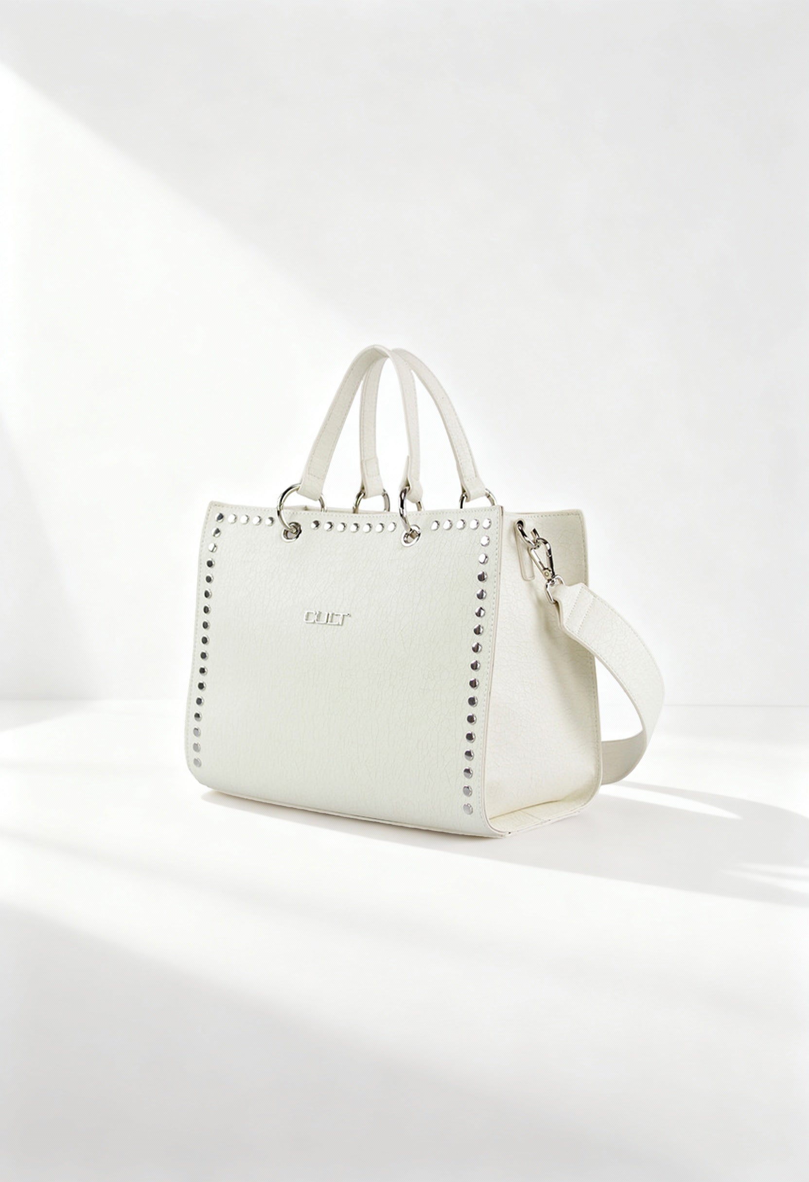 Cult X3EPWX090012 white studded handbag with dual handles and removable strap, displayed in bright studio light.