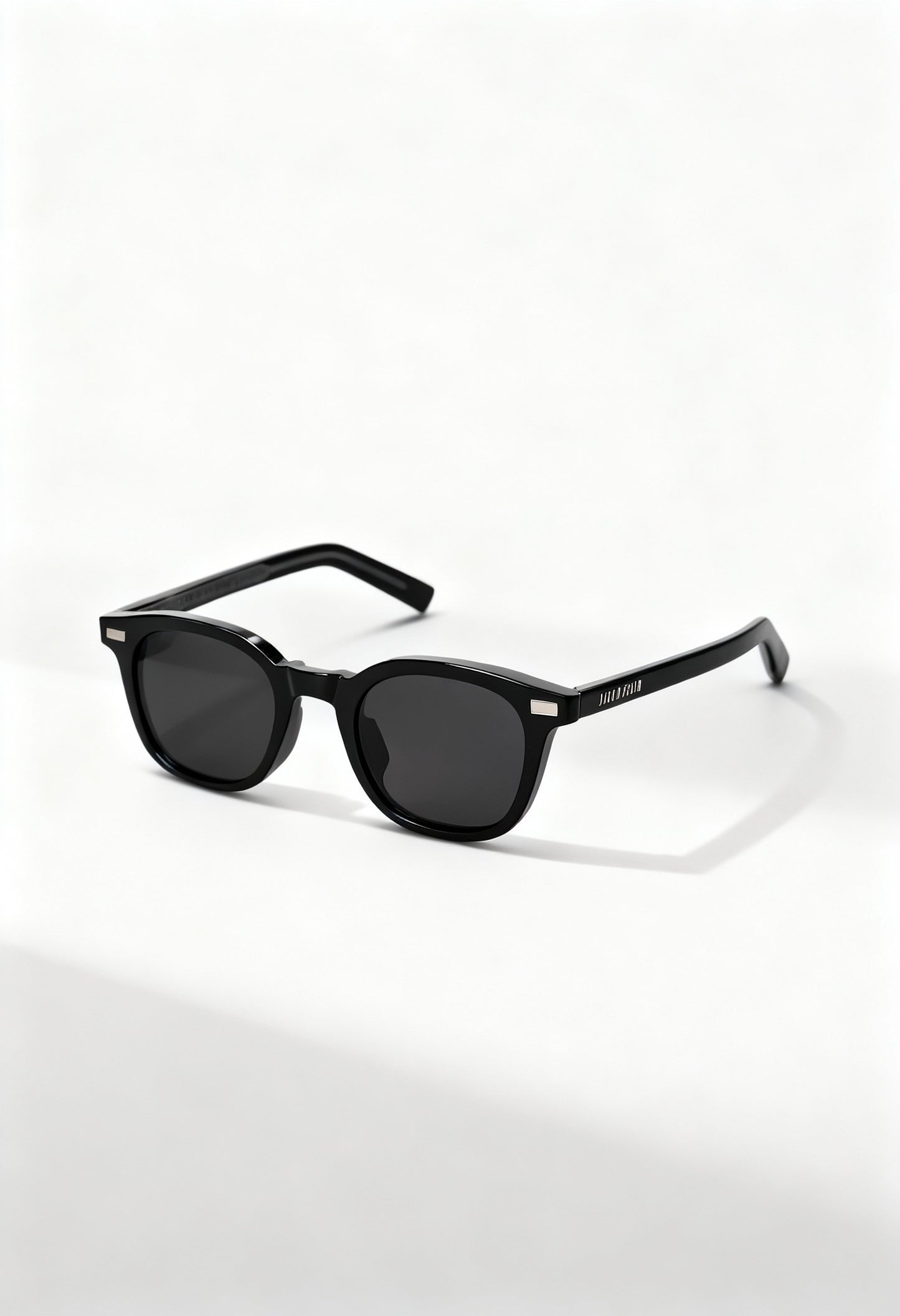 LatenzaZero Zenith unisex sunglasses with black acetate frame and UV3 lenses displayed on a white surface in natural light.

Image 2