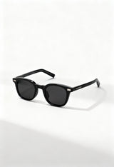 LatenzaZero Zenith unisex sunglasses with black acetate frame and UV3 lenses displayed on a white surface in natural light.

Image 2