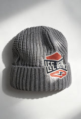 Lee 112358291 grey textured knit unisex beanie hat with bold Lee logo patch, displayed in studio lighting.