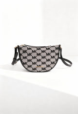 Michael Kors 35S4G4DC5J women’s MK monogram crossbody bag displayed in bright studio lighting.