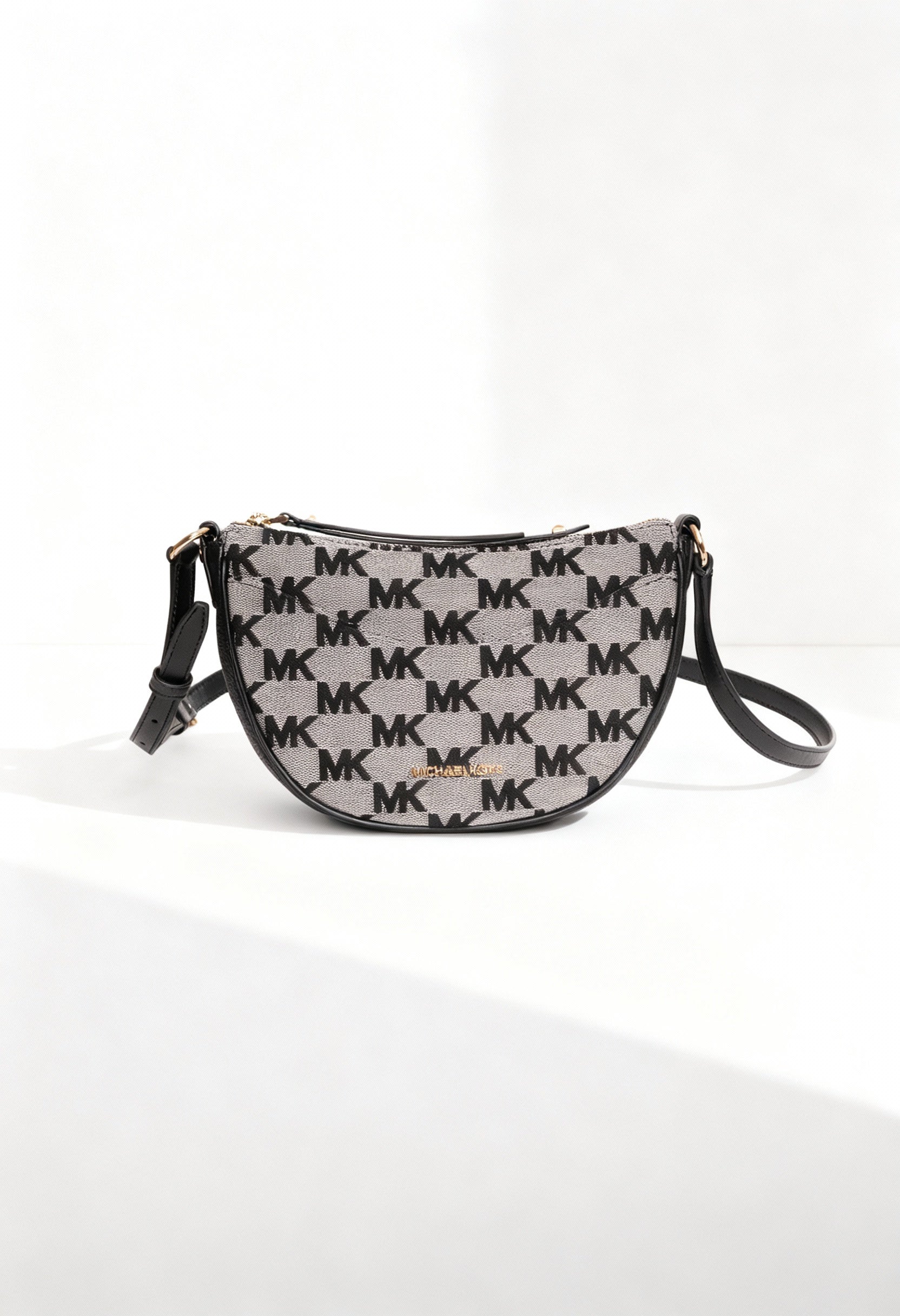Michael Kors 35S4G4DC5J women’s MK monogram crossbody bag displayed in bright studio lighting.