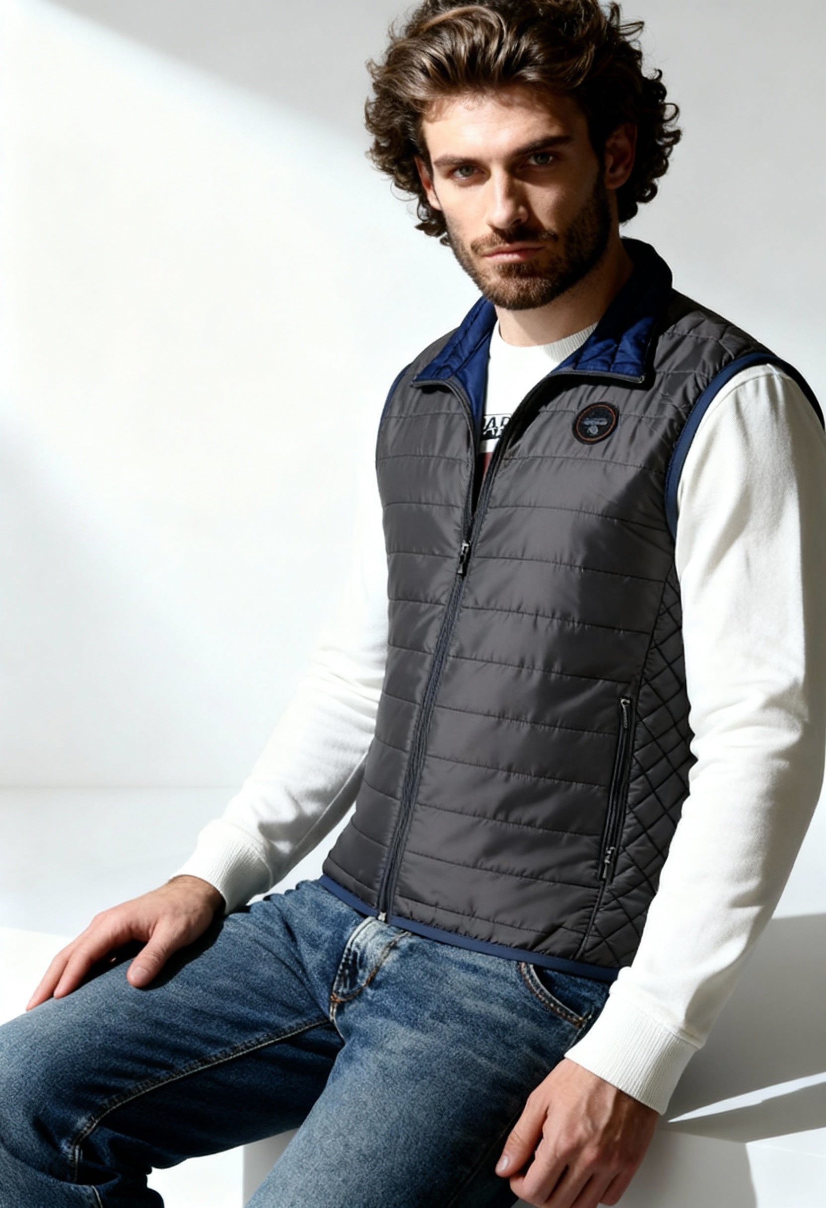 Napapijri NP0A4ECC men's padded vest in dark grey, worn by model, showing slim fit.