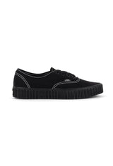 Side view of Vans VN000CR2BLK1 black canvas sneakers featuring round toe and rubber sole.