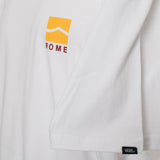 Close-up of Vans VN0A4CYDWHT1 yellow front chest logo printed on white cotton fabric.