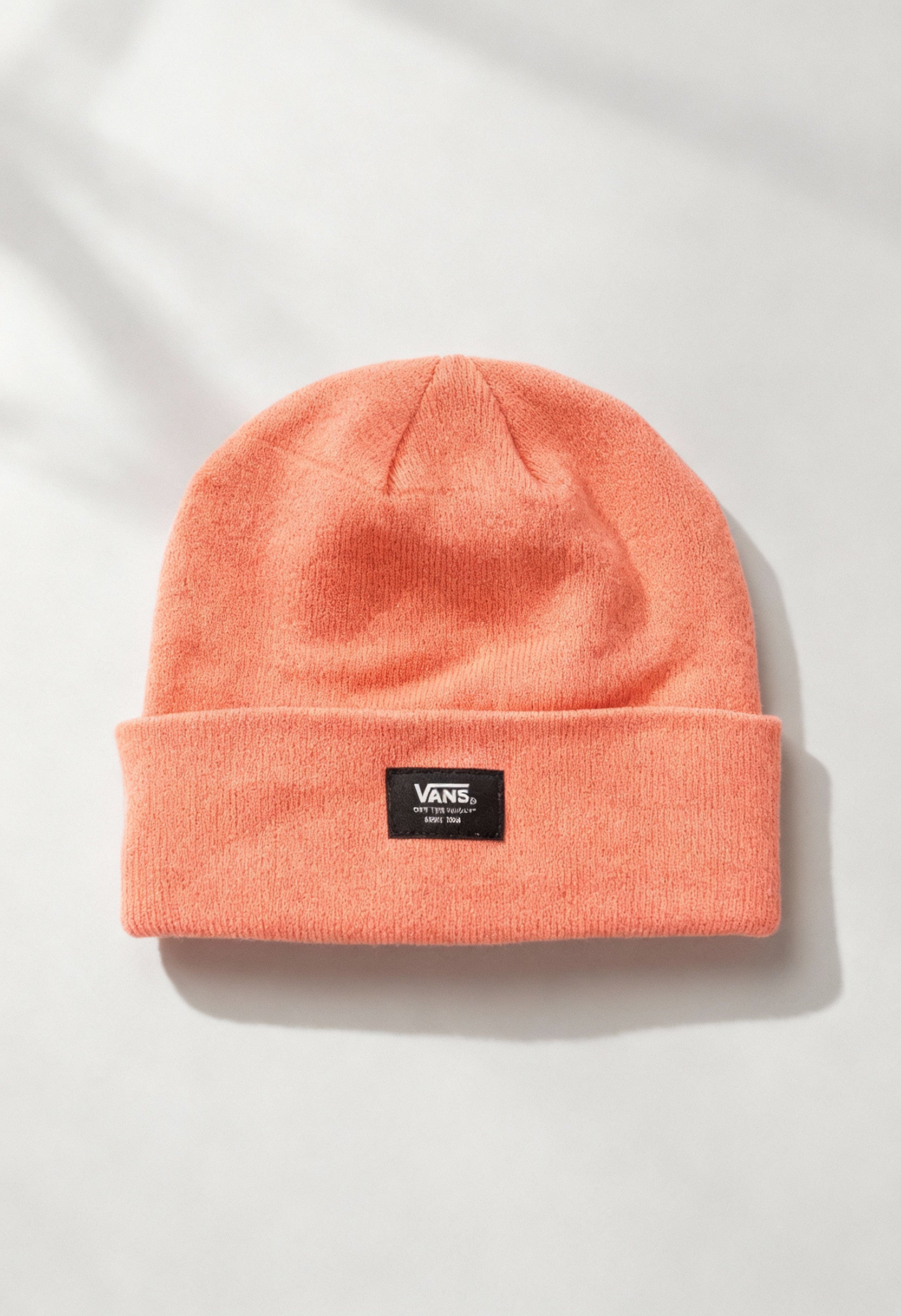 Vans VN0A5GPLQID1 solid orange unisex beanie hat displayed flat with woven Vans logo patch on cuff.