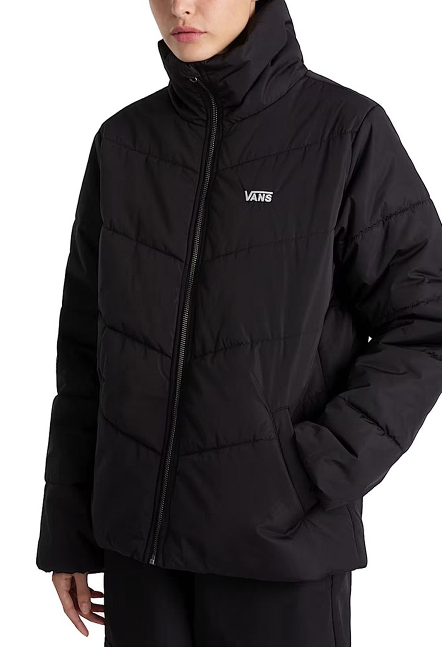 Front angled view of Vans VN0A7YK5BLK1 women’s bomber jacket showing padded texture and logo detail.