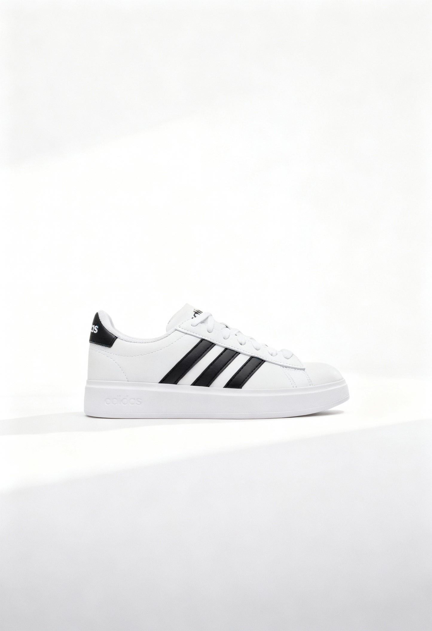 Brand new Adidas Grand Court 2.0 women's sneakers in core white with black 3-stripes side view.