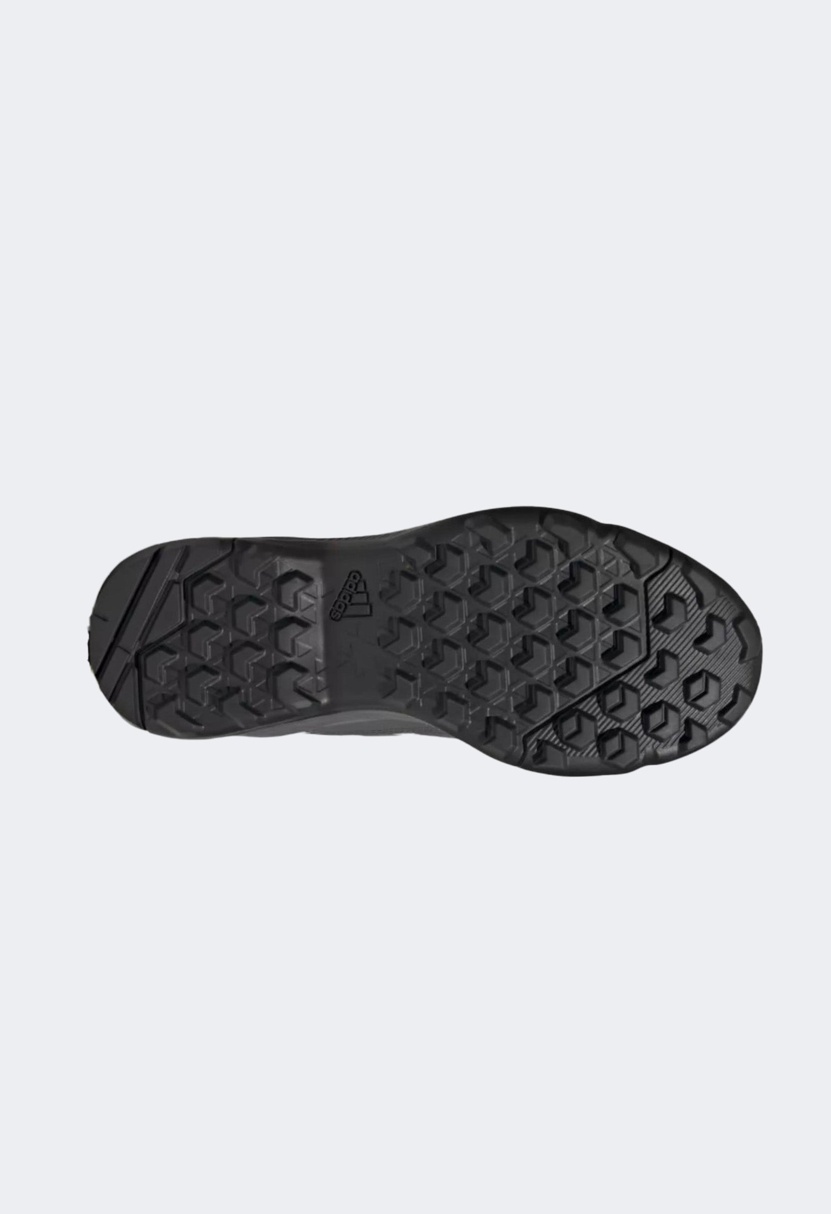 Traxion rubber outsole and multidirectional lug pattern on Adidas Terrex Eastrail GTX for trail grip.