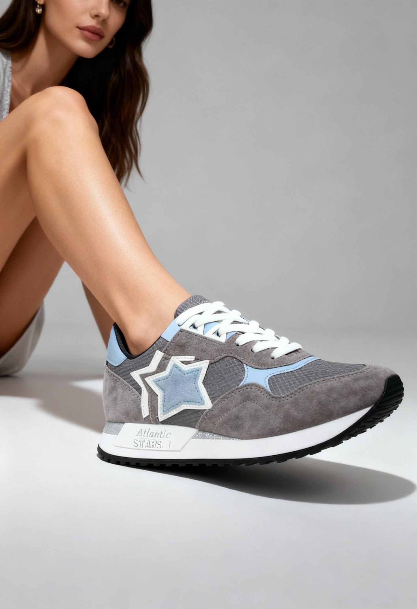 On-foot view of the grey Atlantic Stars GHALAC sneakers with suede panels and signature side star.
