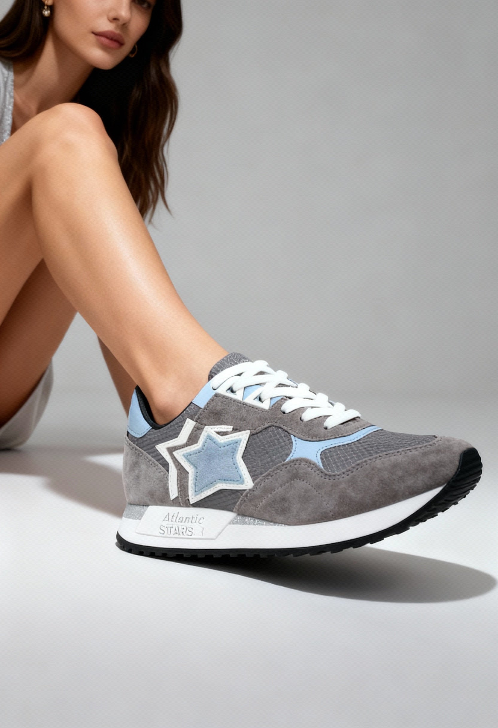 On-foot view of the grey Atlantic Stars GHALAC sneakers with suede panels and signature side star.