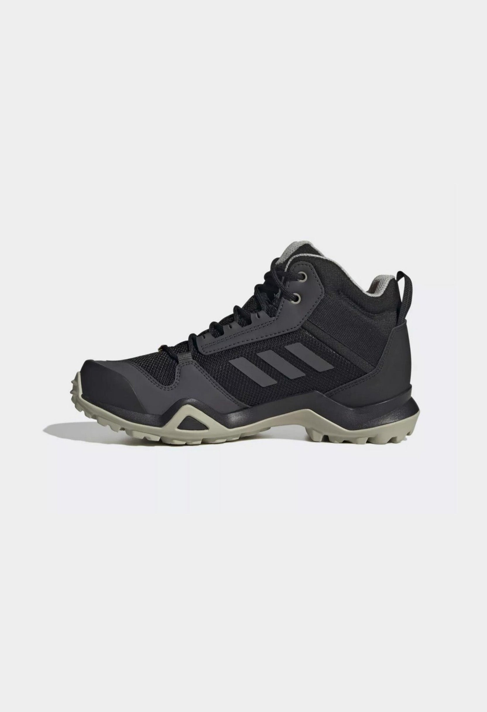 Side profile of authentic Adidas Terrex AX3 Mid GTX waterproof hiking boots for women.