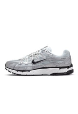 Side profile of authentic metallic silver Nike P-6000 shoes highlighting the layered upper.