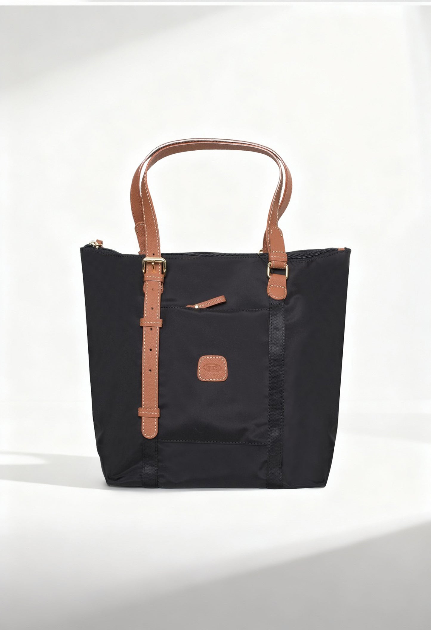 Front studio view of the Bric’s BXG05071-1906603 black nylon shopping bag with brown leather handles.