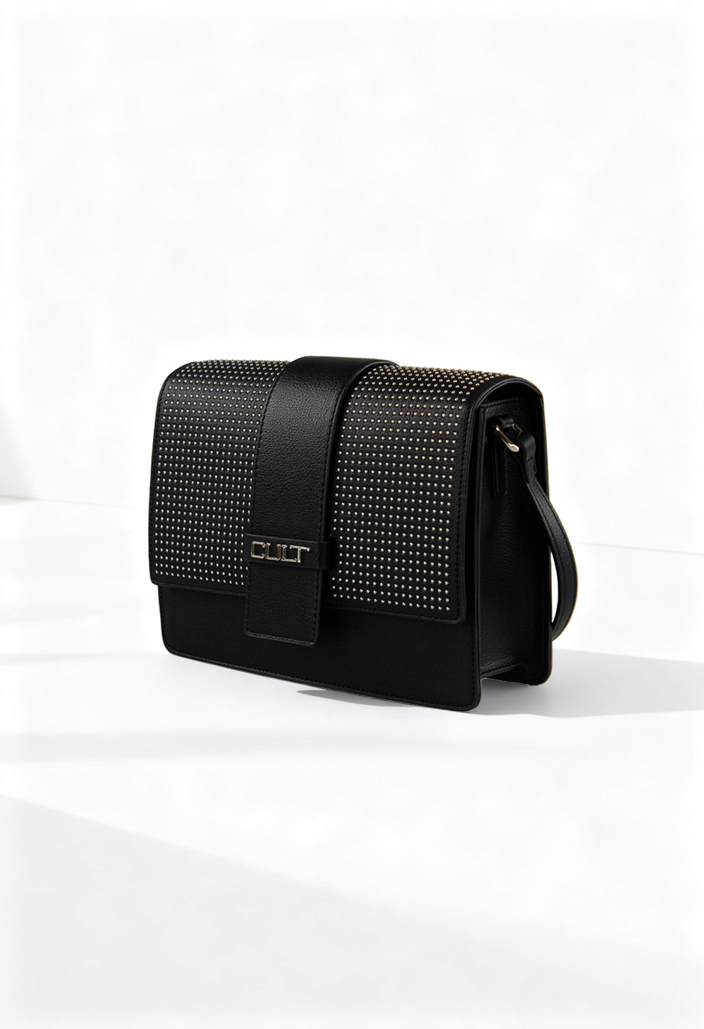 Front view of the black Cult shoulder bag featuring studded detailing and structured shape.