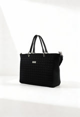 Front angle of the black Cult quilted shopping bag with double handles and structured design.