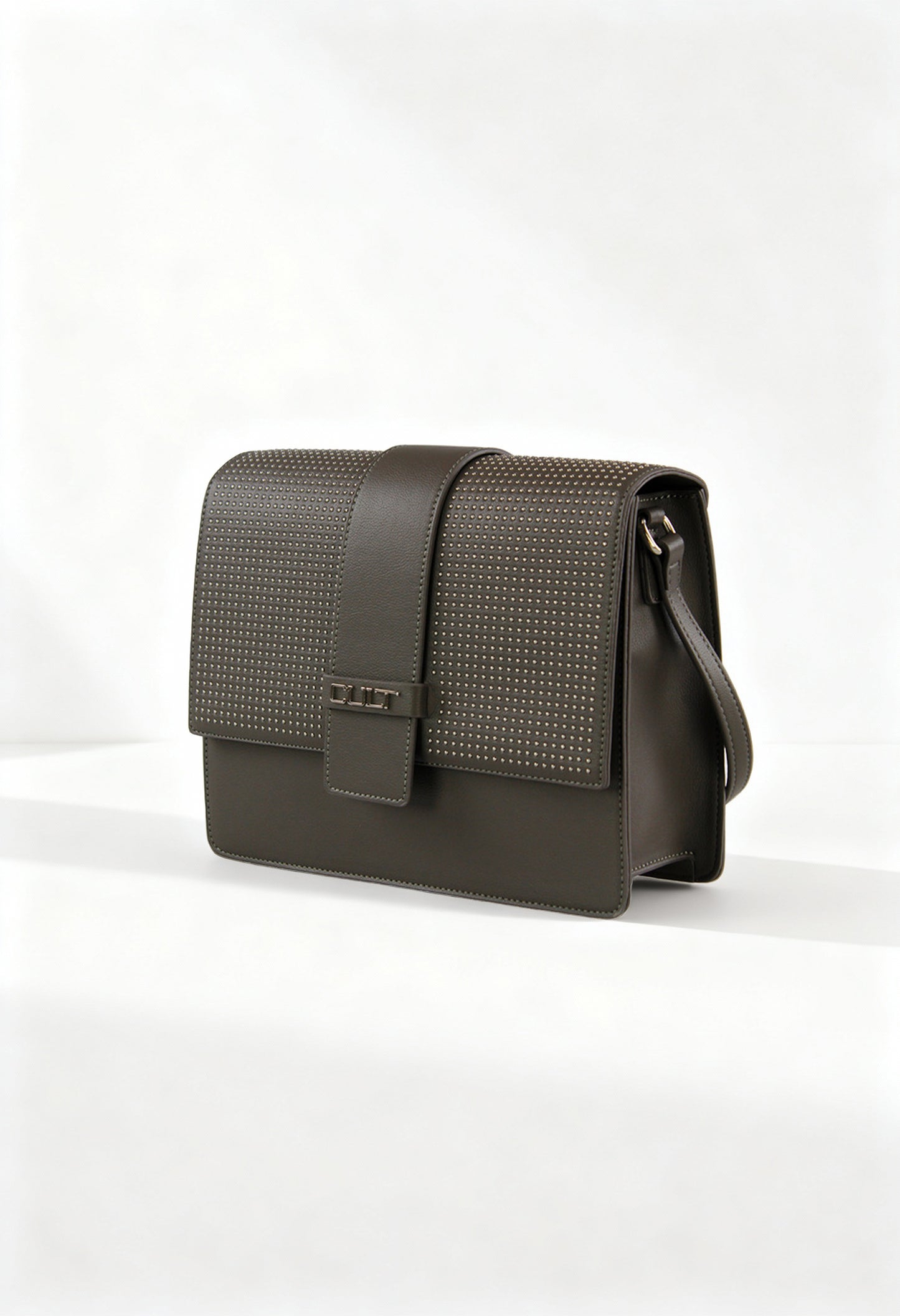 Front angle of the brown Cult shoulder crossbody bag with studded flap and structured design.