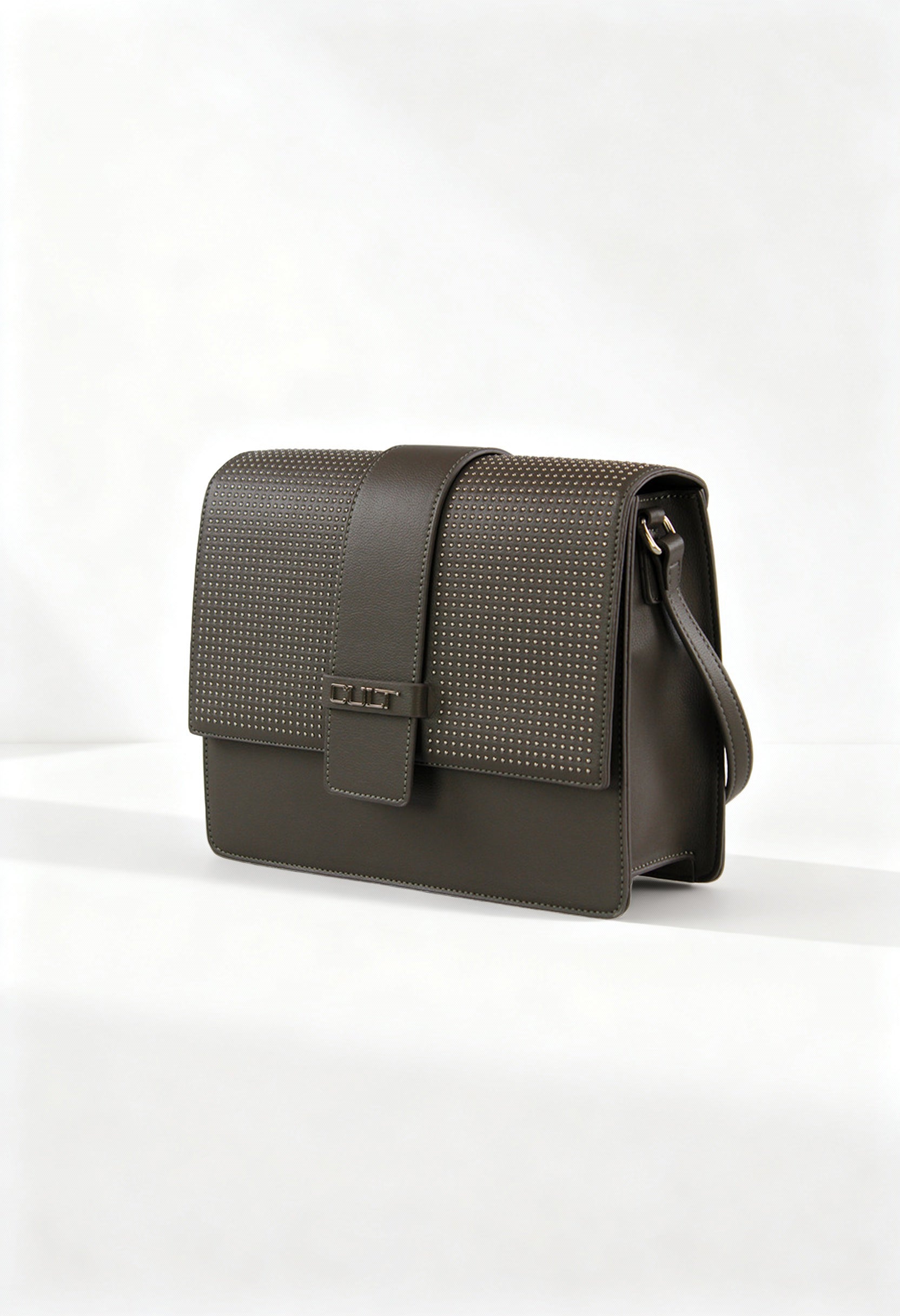 Front angle of the brown Cult shoulder crossbody bag with studded flap and structured design.