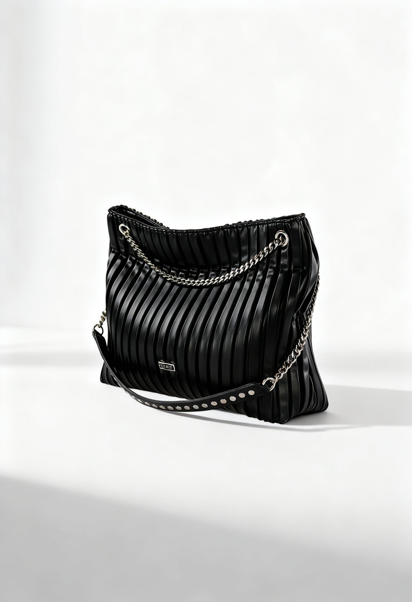 Front angled view of the black Cult X3EPWX080012 luxury shoulder bag featuring pleated texture and metallic chain handle.