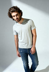 Diesel V-neck T-shirt in light grey (heather grey), worn by male model.