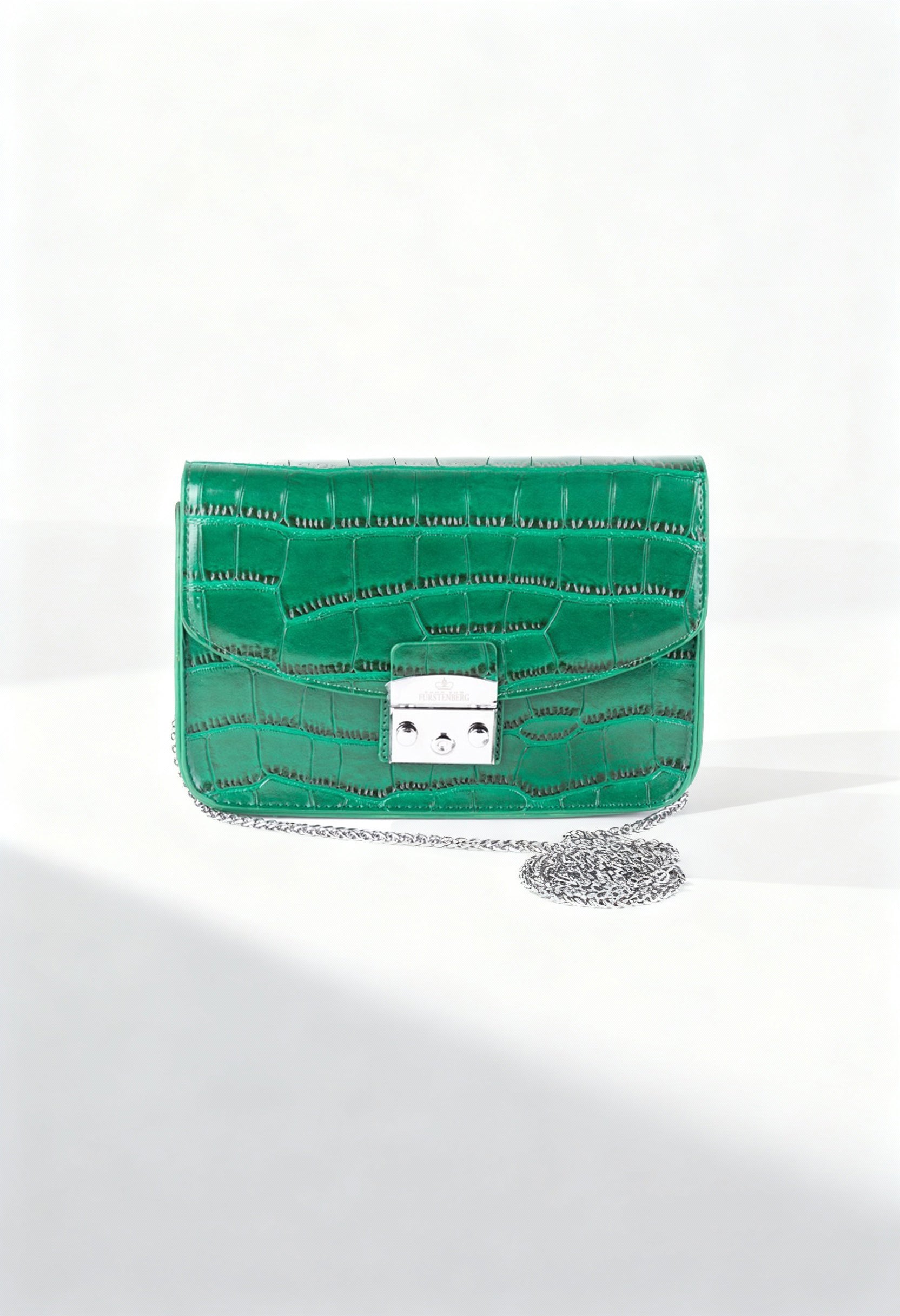 Front display of the green Egon Von Furstenberg Valery crossbody bag with metallic clasp.