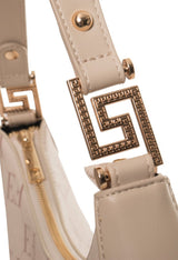 Monogram shoulder bag handle close-up showing visible logo hardware detail.