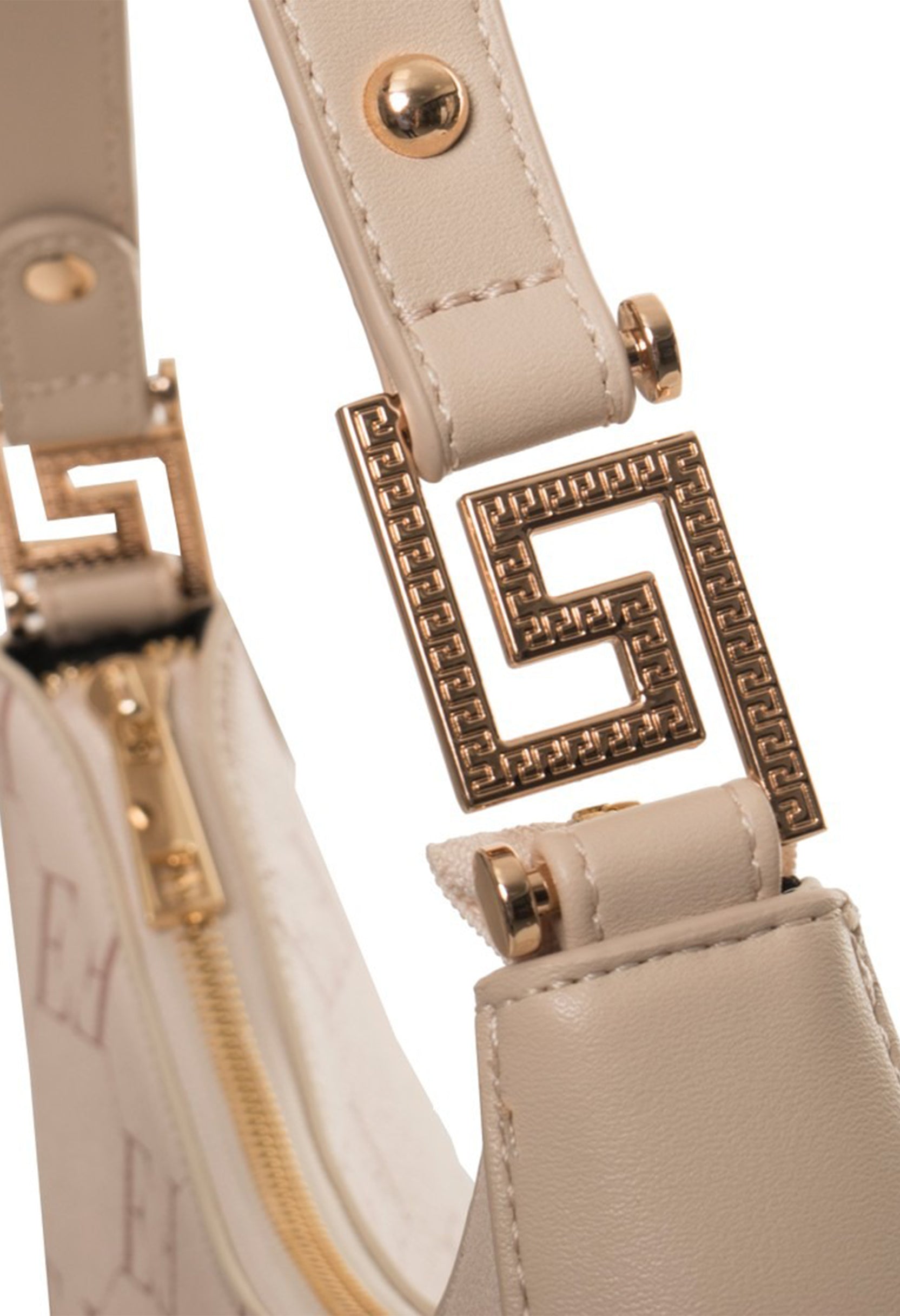 Monogram shoulder bag handle close-up showing visible logo hardware detail.