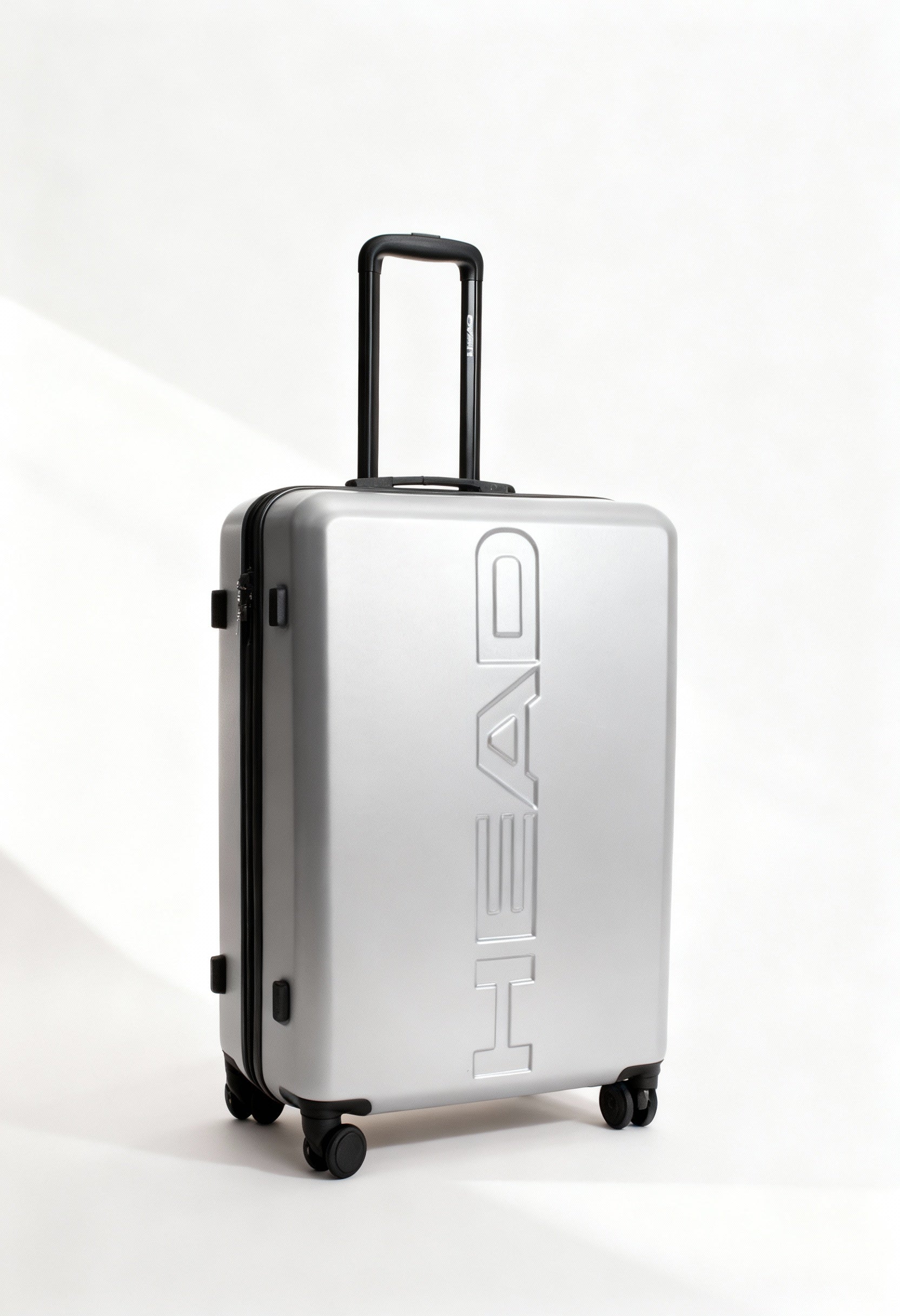 Front angle of the large silver Head HTR006 hard-shell suitcase with telescopic handle.