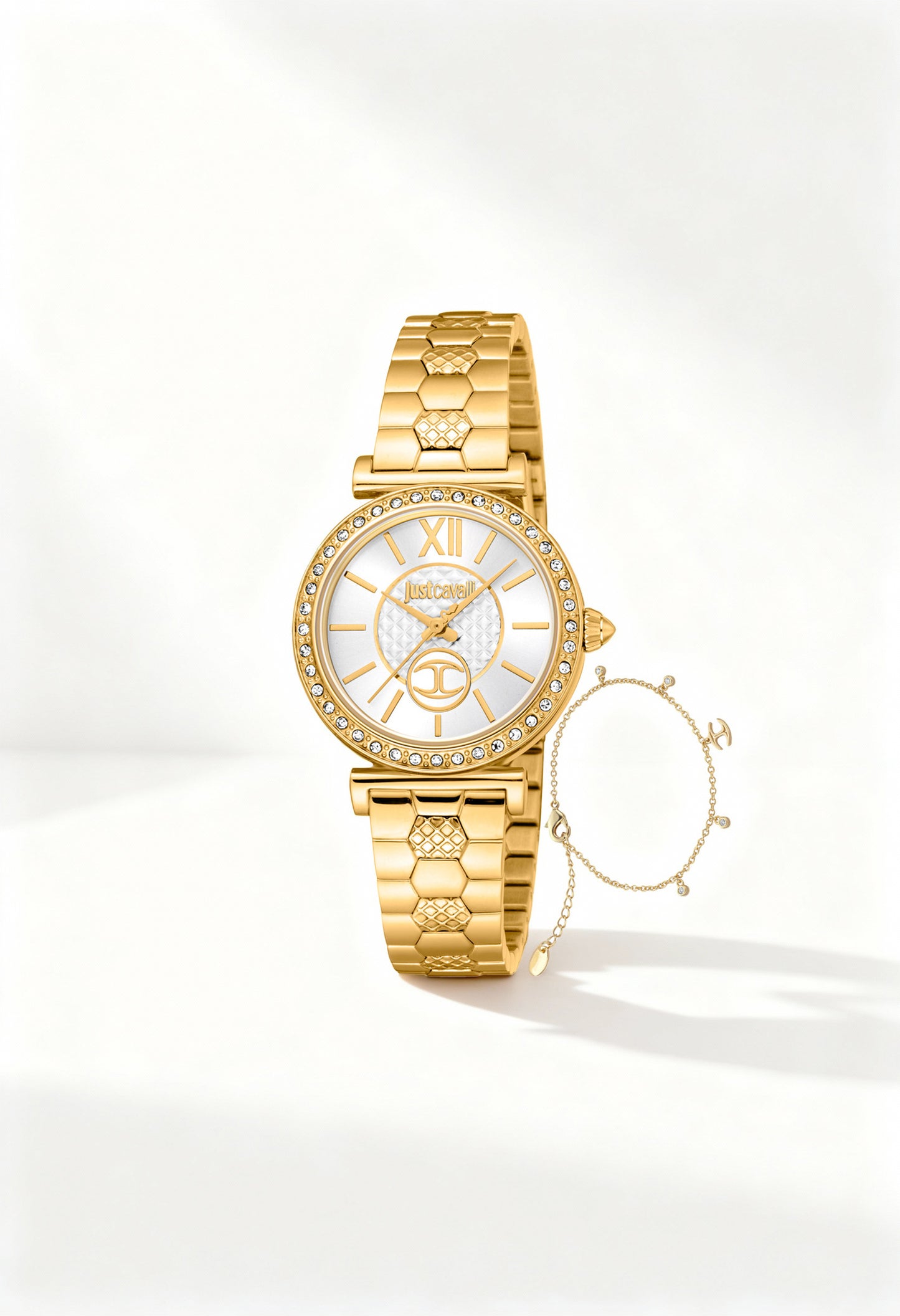 Front angled view of the Just Cavalli JC1L273M0055 woman watch featuring a gold textured bracelet and white dial with crystal bezel.