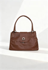 Front view of the Lamarthe LAM103 brown leather shoulder bag with double handles and metallic clasp.