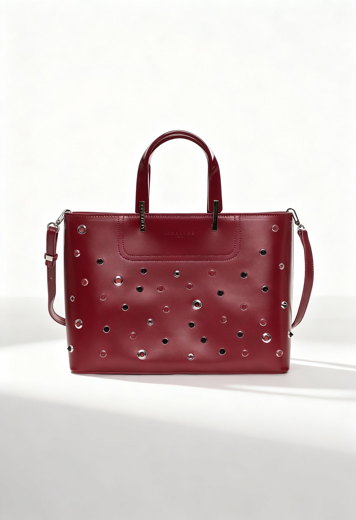 Front view of the Lamarthe PH104 burgundy leather handbag featuring metallic studs and double handles.