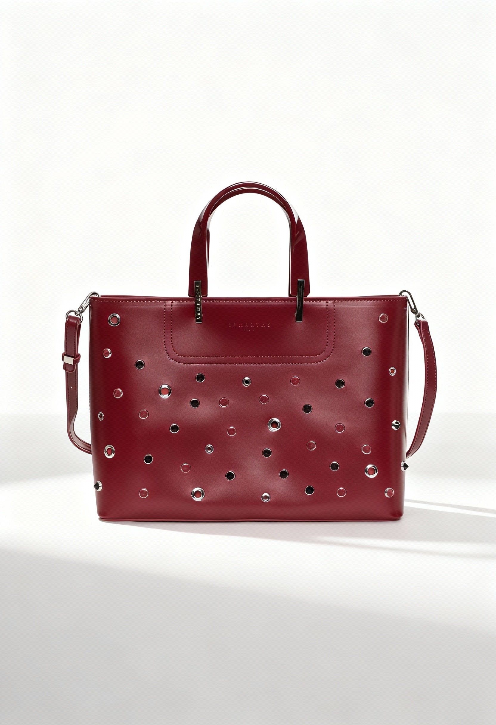 Front view of the Lamarthe PH104 burgundy leather handbag featuring metallic studs and double handles.