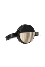 Angled shot of the Lamarthe PR176 round leather crossbody bag showing its textured front and side profile.