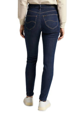 Back view of a woman wearing the dark blue Lee L626MDNX skinny jeans, showing pockets and fit.