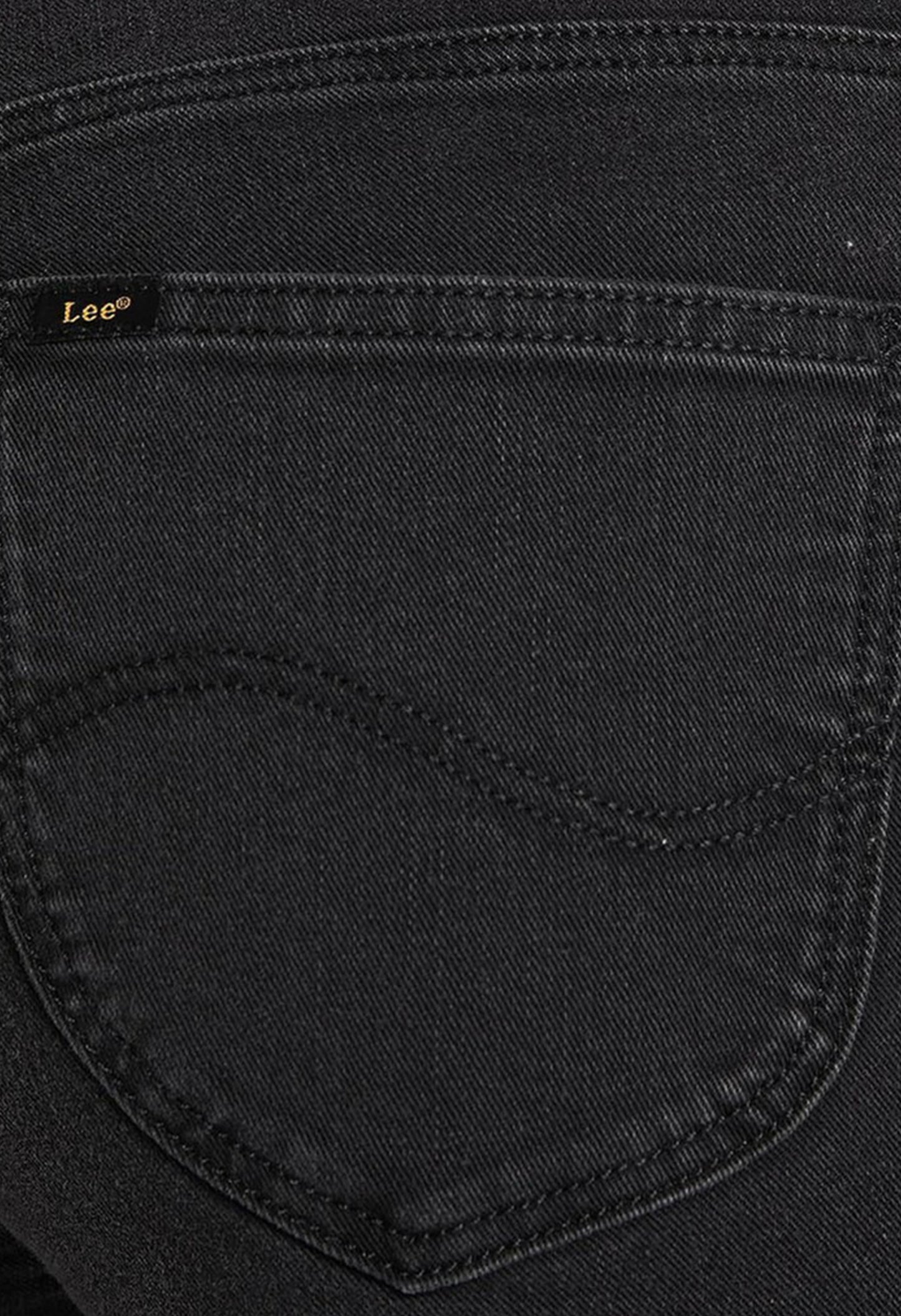 Close-up detail of the back pocket and fabric texture of the black Lee L626SHMY skinny jeans.
