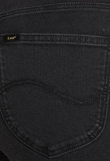 Close-up detail of the back pocket and fabric texture of the black Lee L626SHMY skinny jeans.