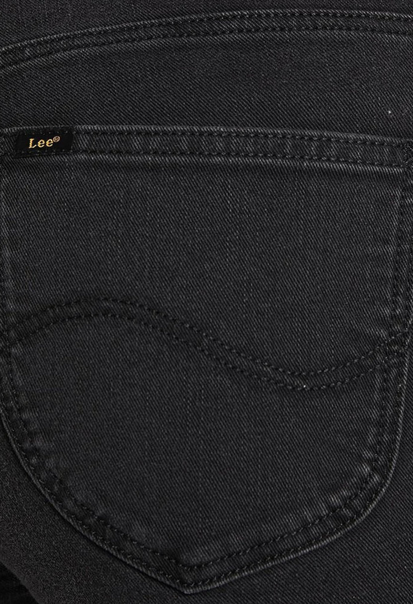 Close-up detail of the back pocket and fabric texture of the black Lee L626SHMY skinny jeans.