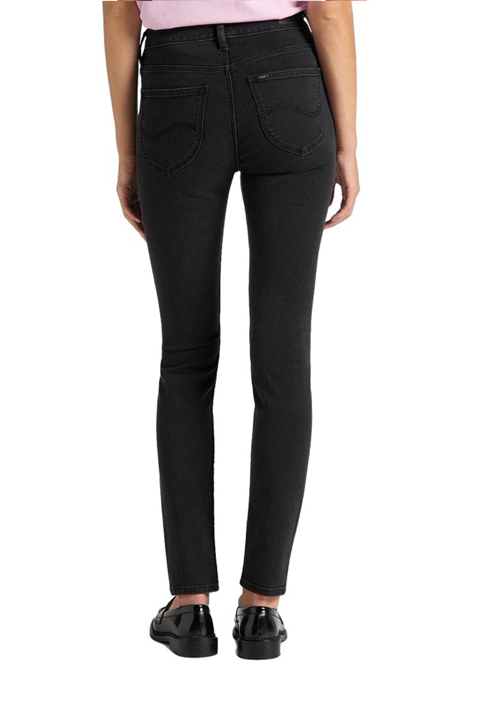 Back view of a woman wearing black Lee L626SHMY skinny jeans showing pockets and fit.