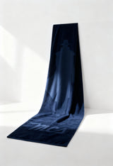 MCS 10BTL001 large cotton logo towel in navy blue, laid flat, visible logo.