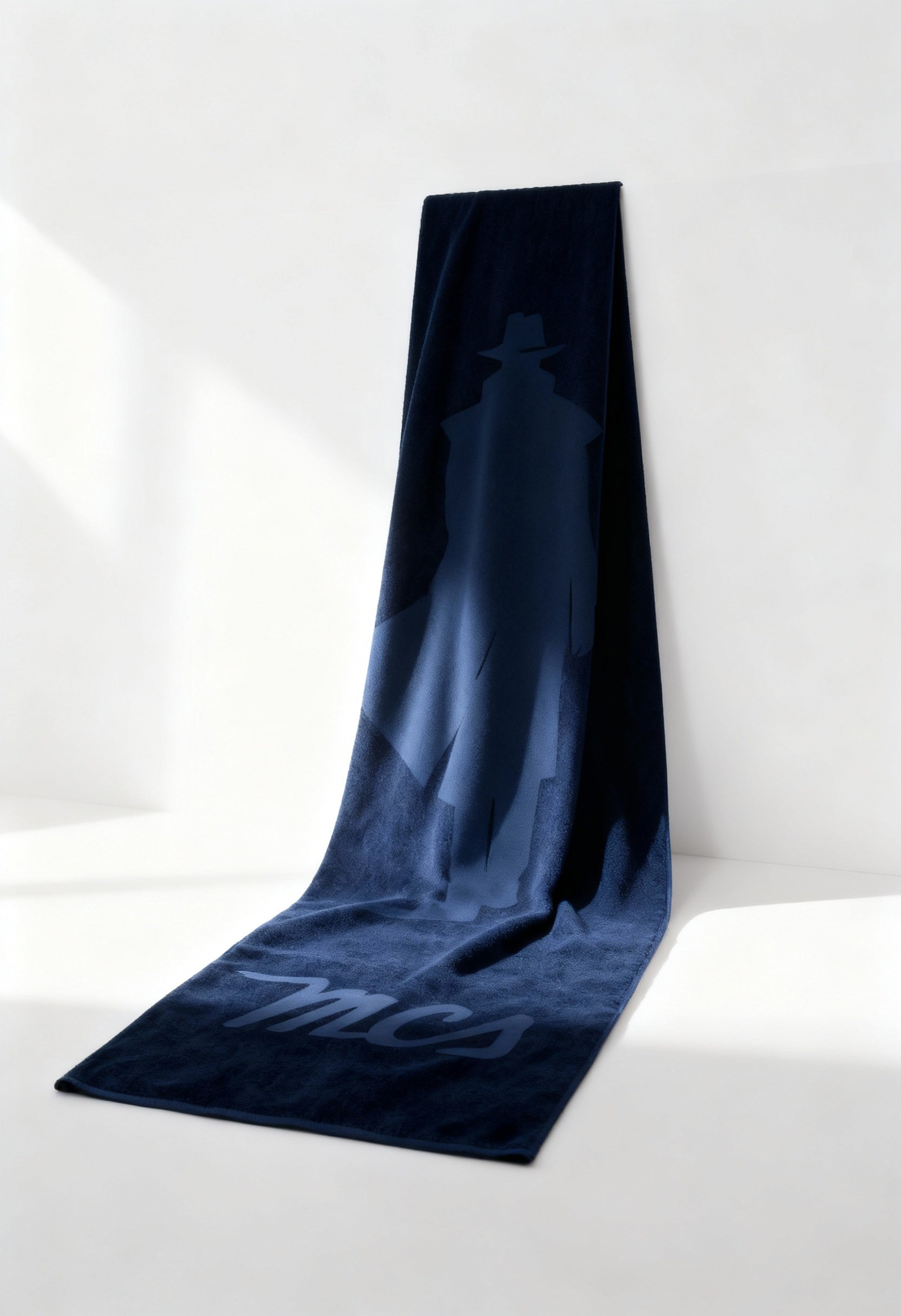 MCS 10BTL001 large cotton logo towel in navy blue, laid flat, visible logo.