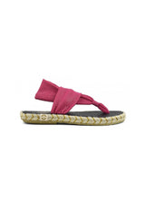 Side view of the pink Nalho cross-strap flip-flop sandals showing braided midsole and fabric straps.