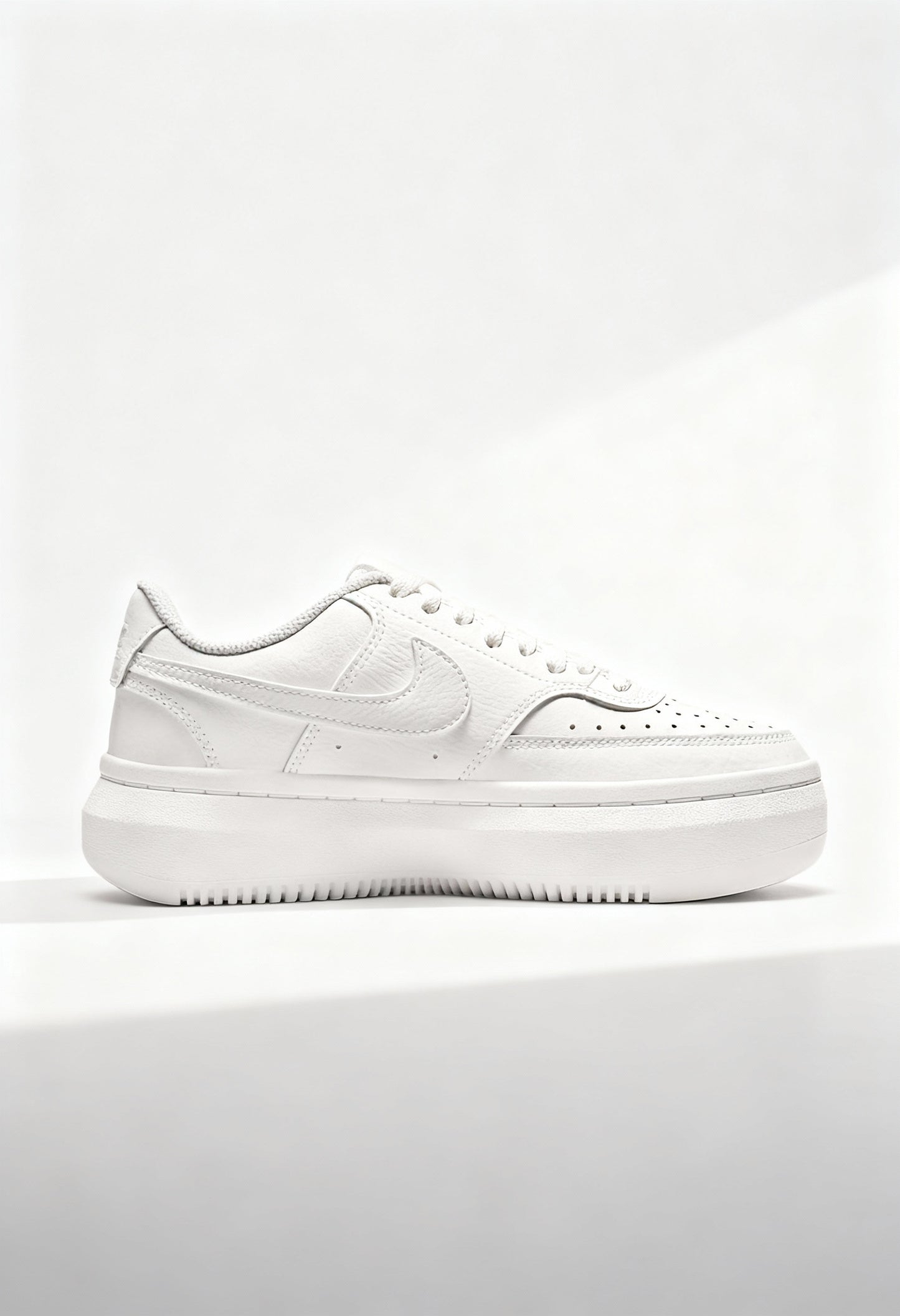 Brand new Nike Court Vision Alta women's sneakers in triple white side view.