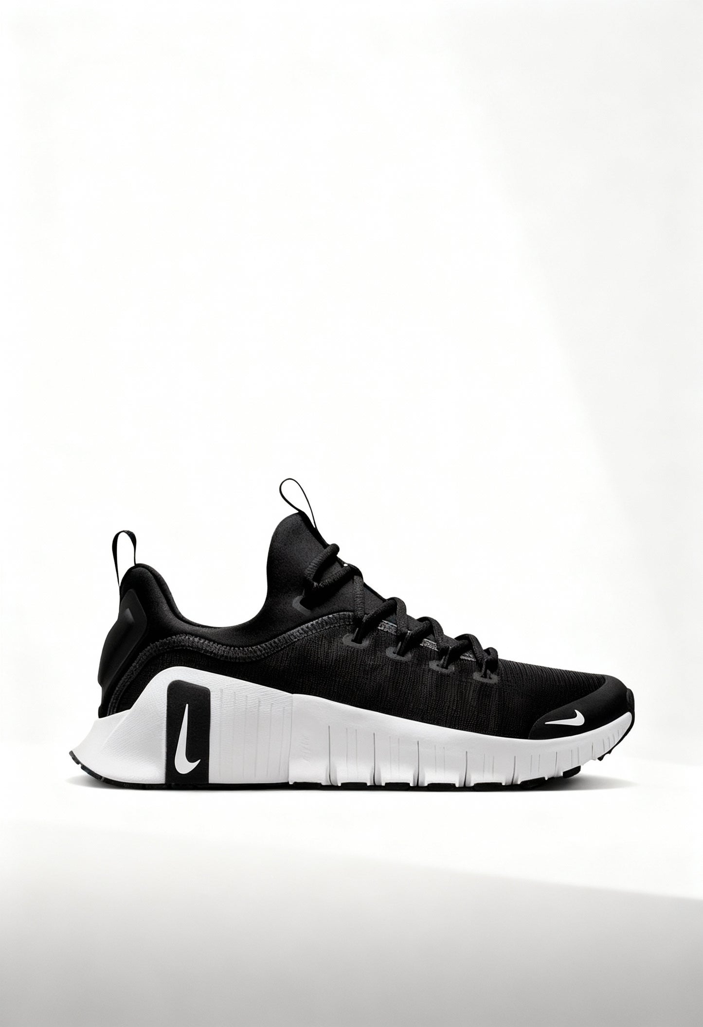 Brand new Nike Free Metcon 6 women's training shoes in black and white side view.