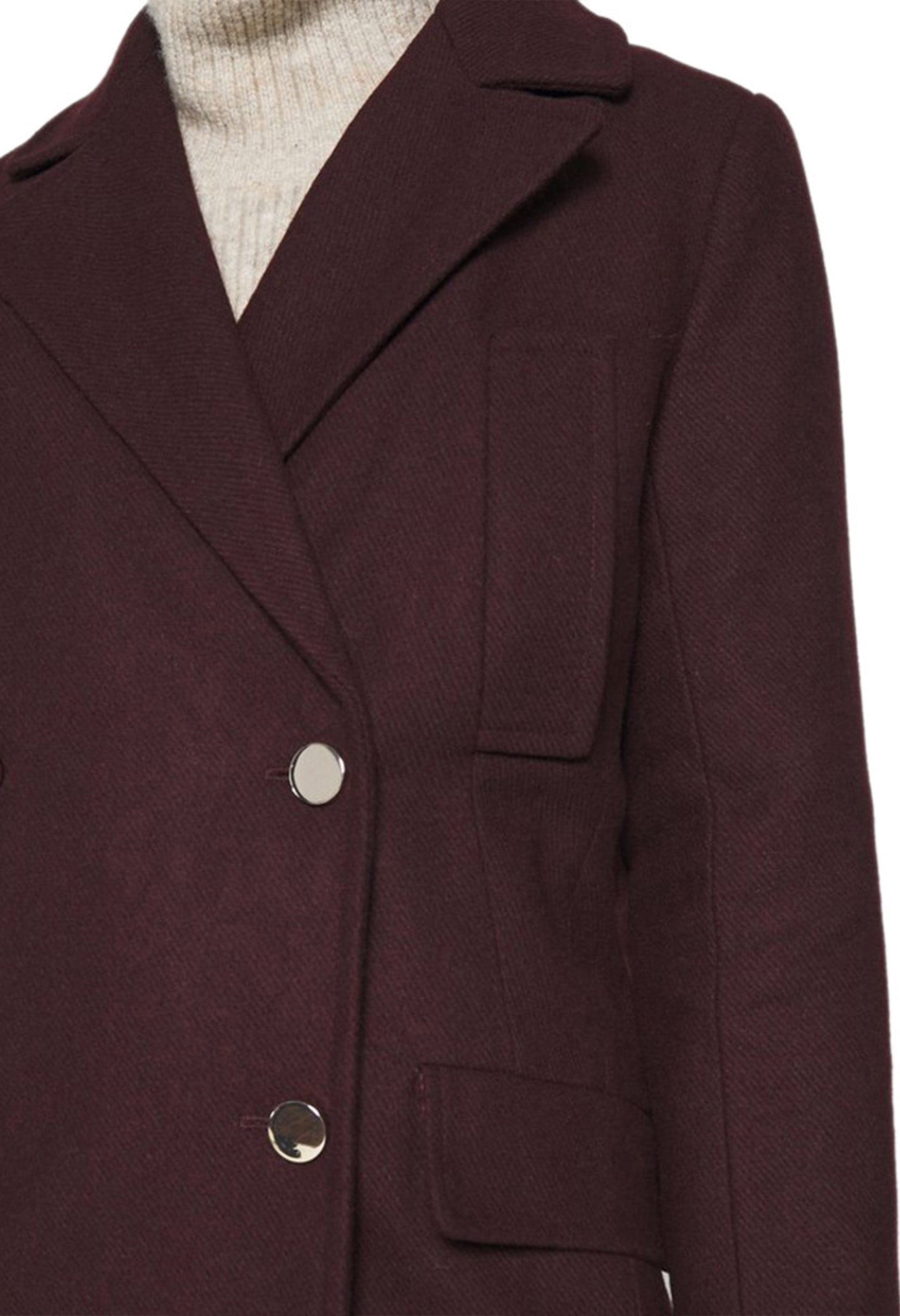 Close-up front detail of the LEYRE coat highlighting the buttons and lapel structure.