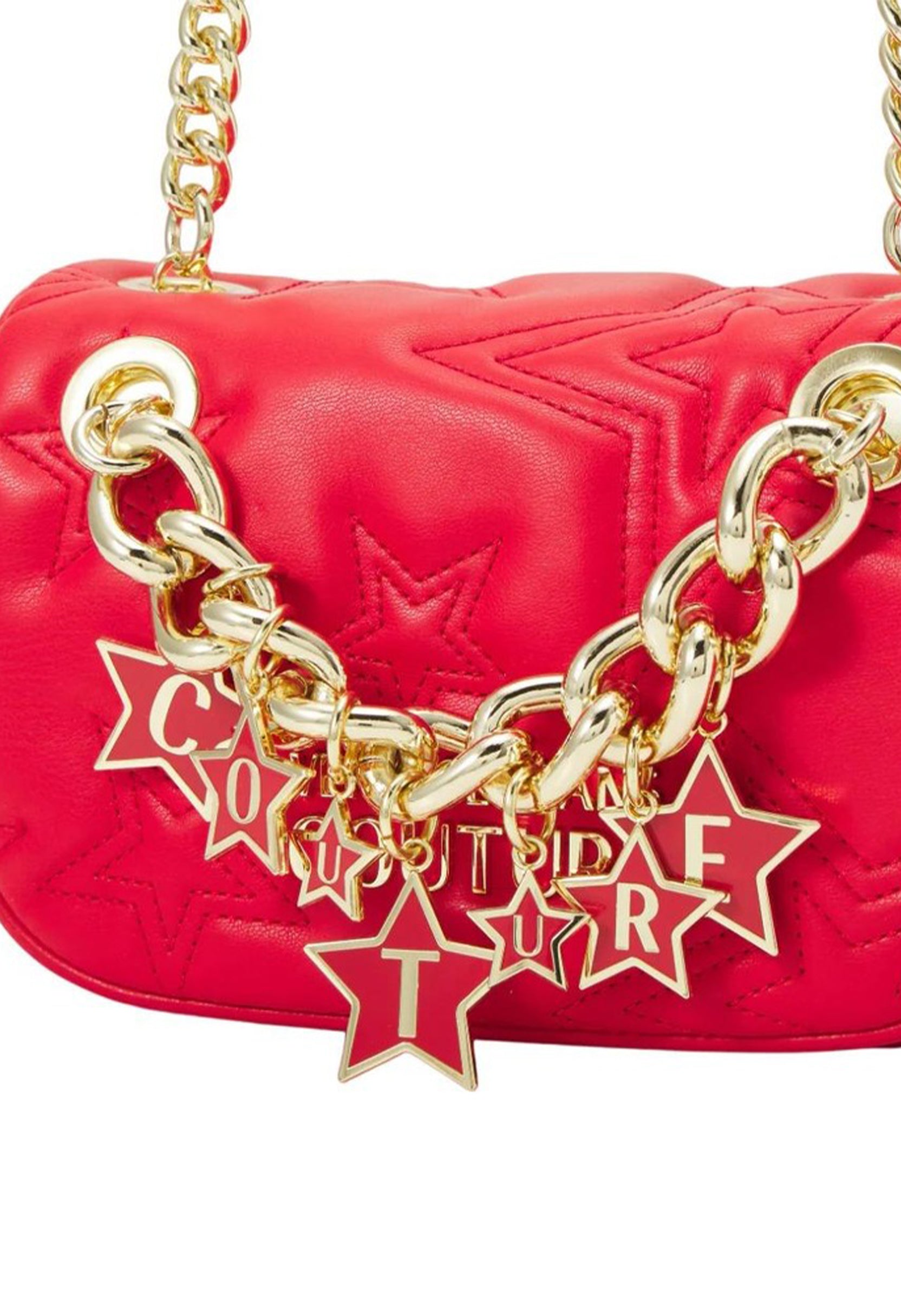Close-up showing the gold chain star charm on the red women’s crossbody bag.