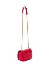 Full front shot of the red women’s crossbody bag with quilted texture and gold accents.