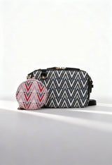 Front angled view of the Valentino TONIC-VBS69904 patterned black crossbody bag with removable coin pouch.