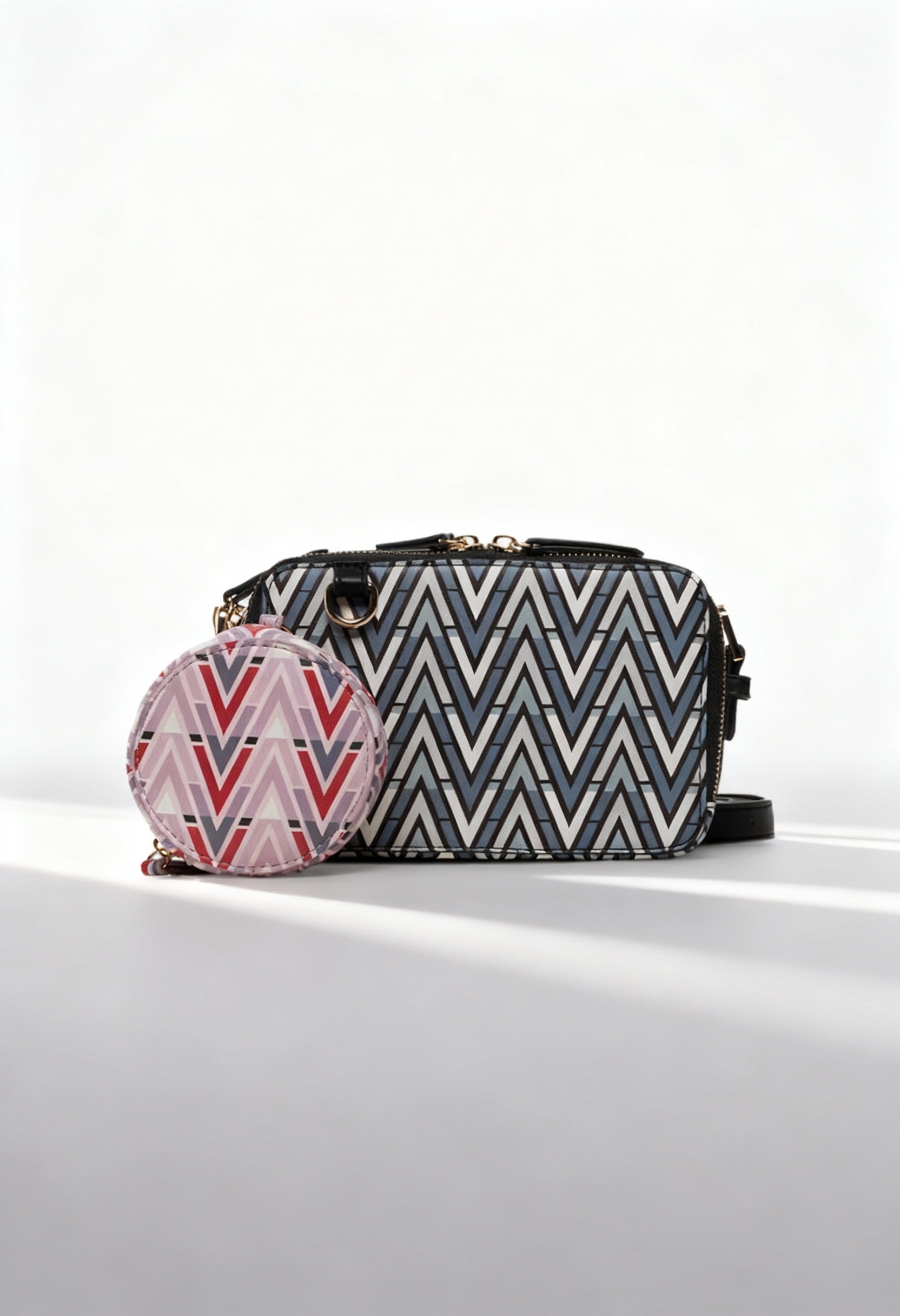 Front angled view of the Valentino TONIC-VBS69904 patterned black crossbody bag with removable coin pouch.